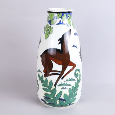 a white vase with a picture of a horse on it