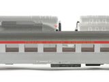 two trains that are sitting side by side on a white surface