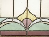 a close up of a stained glass window in a room