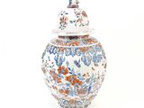a large vase with a lid on a white background