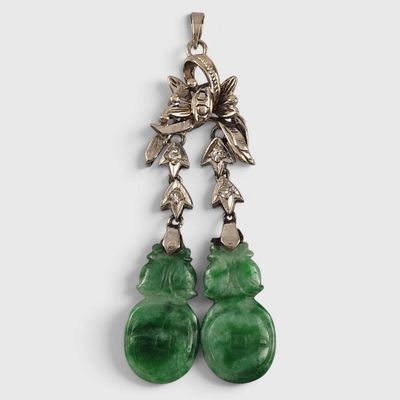 a pair of green jade and silver earrings