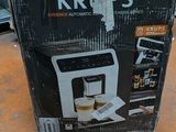 a box that is sitting on a table with a coffee maker