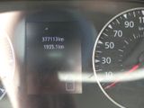 a close up of a car dashboard with a speedometer