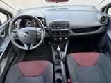 the interior of a small car with a steering wheel and dashboard