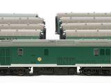 two trains that are sitting side by side on the tracks