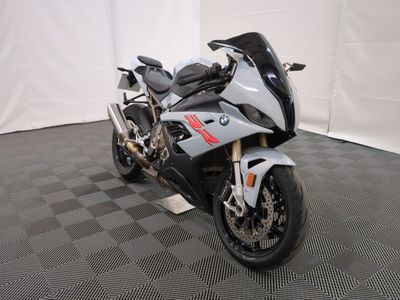 a picture of a motorcycle parked on a black and white checkered floor