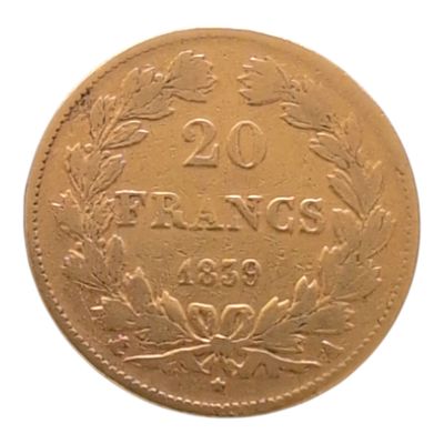 une ancienne pièce française de 20 francs sur fond blanc