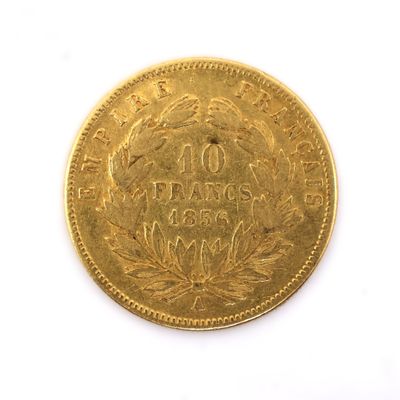 an image of a gold coin on a white surface with a white background