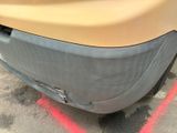 a close up of a car ' s bumper with a red line painted on it