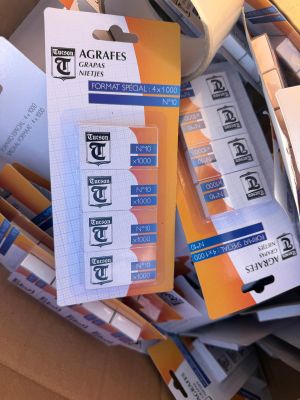 a cardboard box filled with a lot of different types of labels