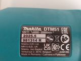 a close up of a blue bottle with a label on it