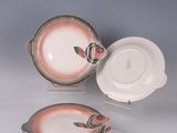 several plates and bowls are stacked on top of each other