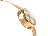 a close up of a gold watch on a white background