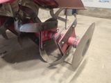 a close up of a plow on a concrete surface