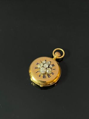 a close up of a gold locke with a clock on it