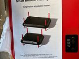 a red box with a picture of a smart broder heating plate