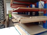 many shelves that have different types of wood in them