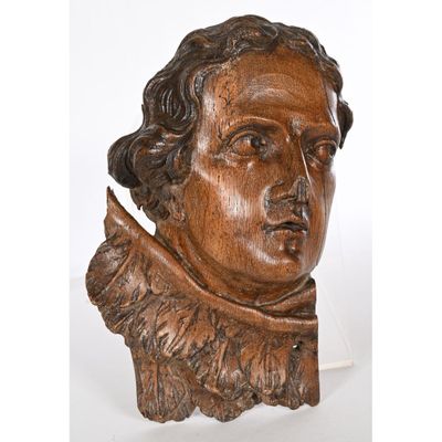 a close up of a bust of a man wearing a collared shirt