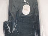 men ' s black pants in a plastic bag on a white surface