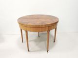 an image of a round table with a wooden top and legs