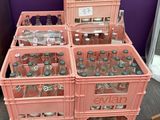 several crates of soda bottles are stacked on top of each other
