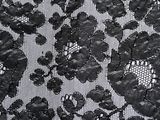 black and white photograph of a black and white dress with flowers on it