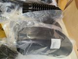 a black blow dryer sitting on top of a table