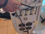 a person that is holding a machine in their hand