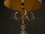 a lamp that is sitting on a table with a lamp shade on it
