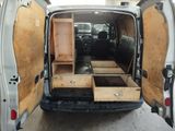a white van with two drawers in the back of it