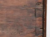 a close up of a wooden drawer with a drawer underneath it