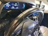 a steering wheel and dashboard of a car in a car showroom