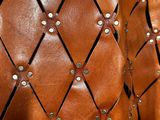 brown leather bag with rivets and rivets on it