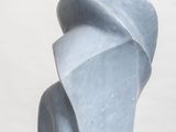 a sculpture that is sitting on top of a white pedestal