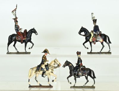 three figurines of soldiers on horses with a flag on their head