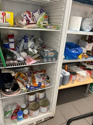 a refrigerator filled with lots of food inside of it