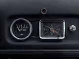 a close up of a car dashboard with a clock and gauges