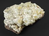 a close up of a rock with a lot of white crystals on it