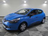 a blue car parked in a garage with a checkered floor