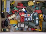 a box full of toy cars and trucks in it