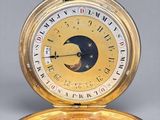 an image of a pocket watch with the moon on the dial