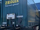 a truck that is parked in front of a building