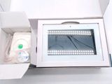 a white box with a monitor inside of it