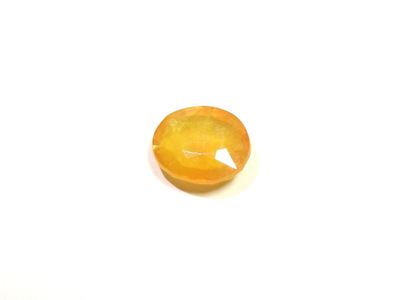 a close up of a piece of fruit on a white surface