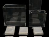 three clear boxes that are sitting next to each other