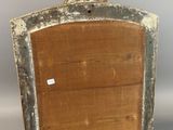 an old wooden picture frame with a crown on top of it