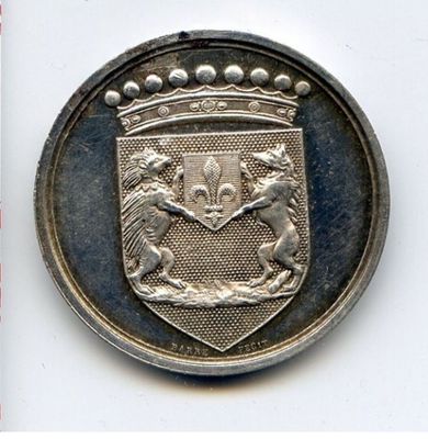 a silver coin with a coat of arms and a lion on it