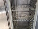 an open refrigerator that is sitting in a room