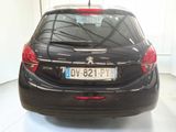 a black car that is parked in a room