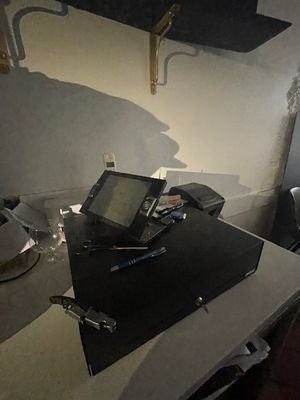 a laptop computer sitting on top of a desk in a room